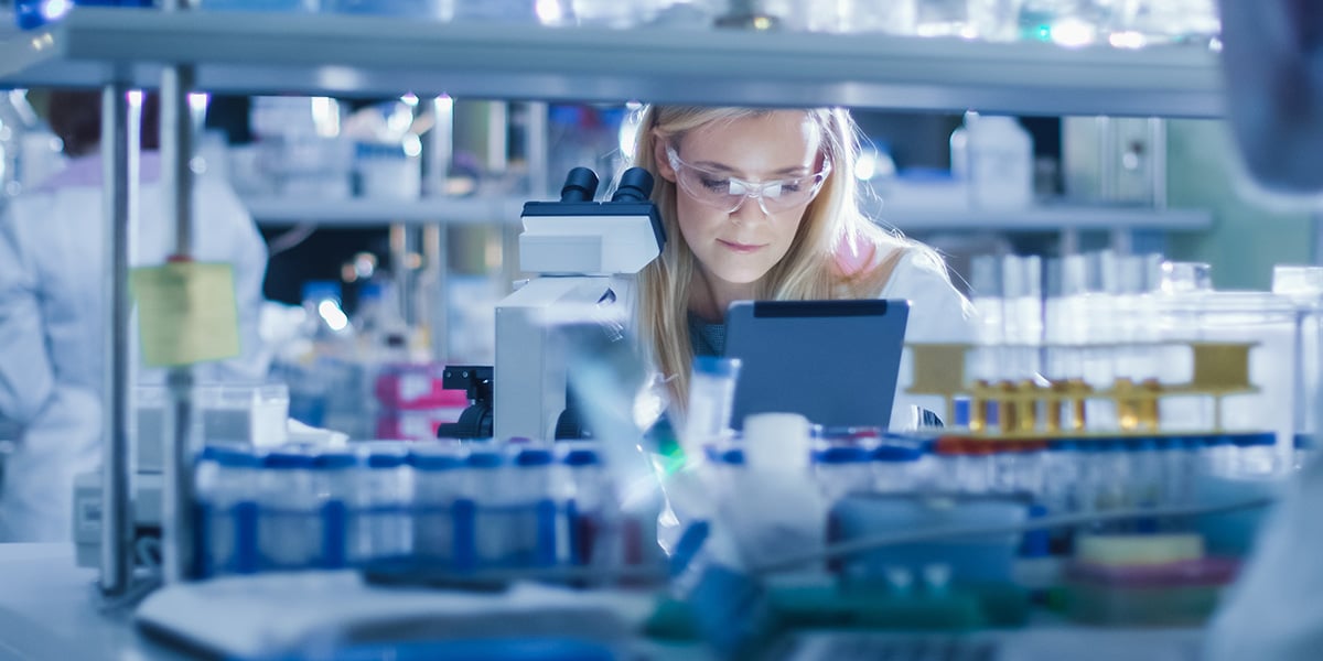 Women in a laboratory undertaking document control